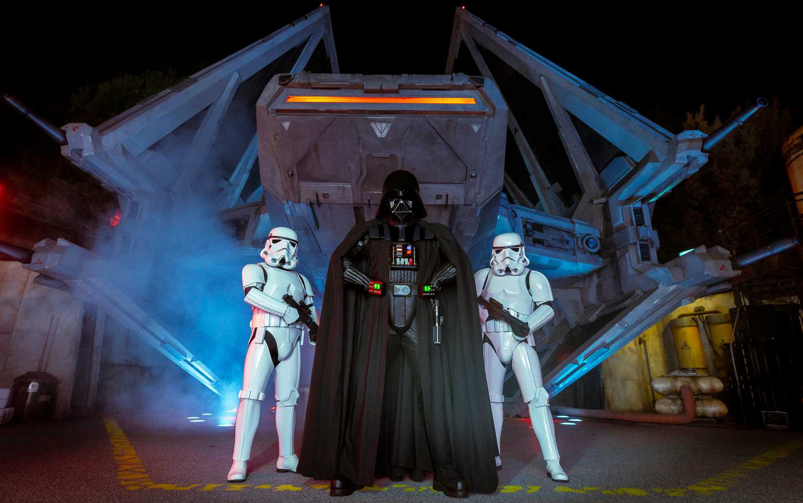 darth vader in front of galaxys edge ship