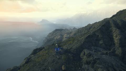 Driving over a mountain in Death Stranding 2 On the Beach (2025)