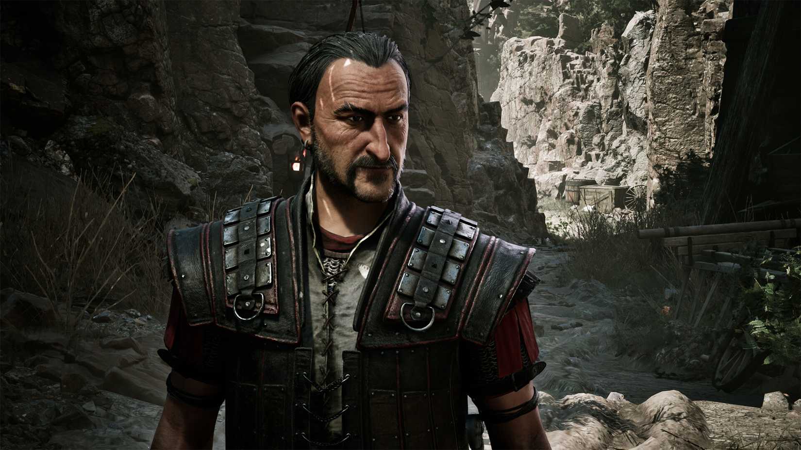 Gothic 1 Remake Press Image 1 A man in leather armor stands against a rocky landscape