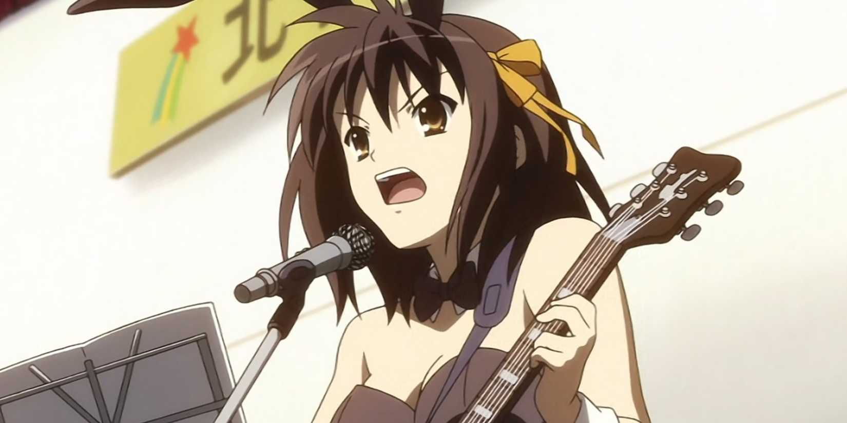 Haruhi Suzumiya dressed as a bunny girl playing guitar.
