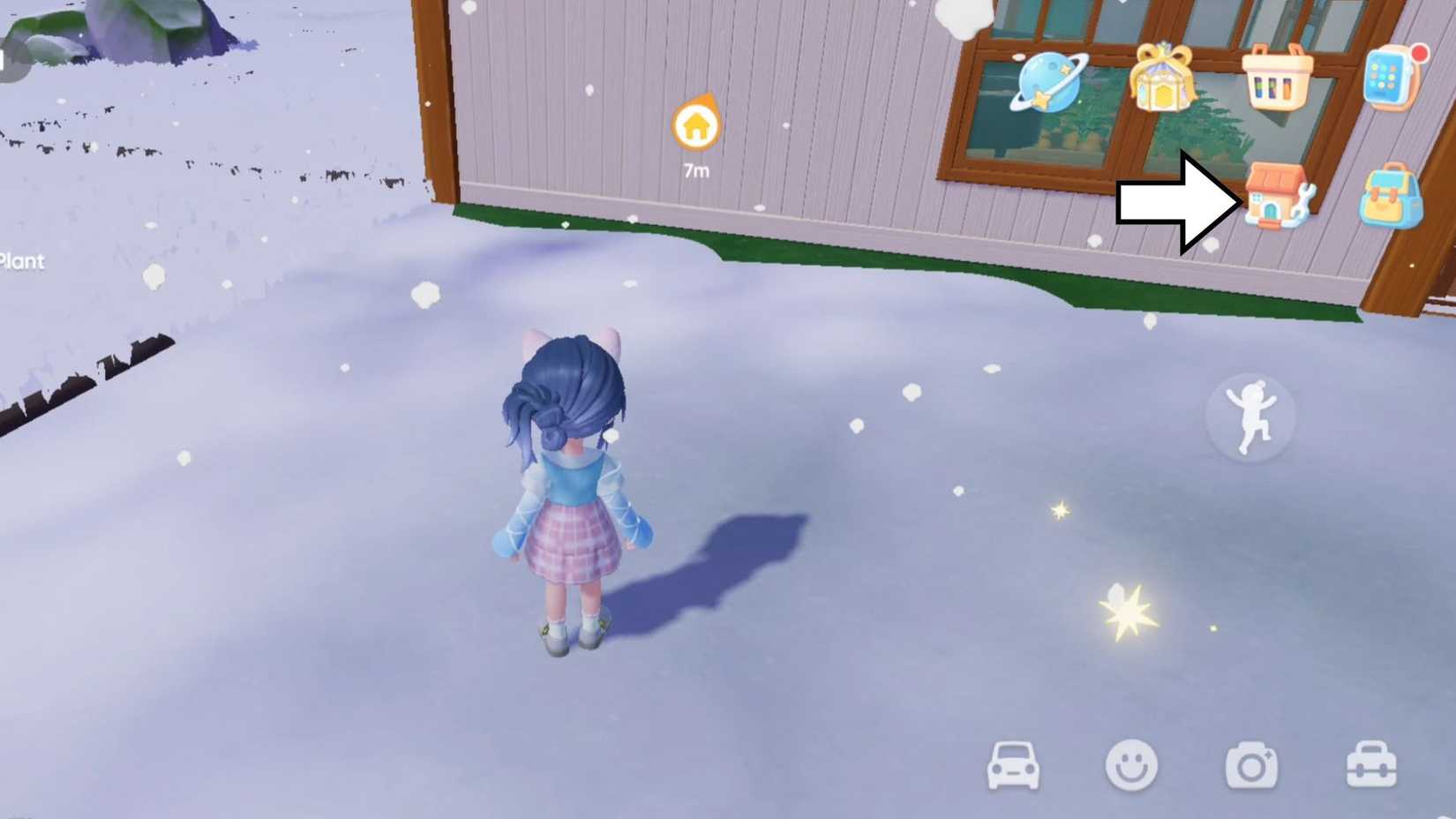 An arrow pointing towards the icon that represents Build Mode in Heartopia