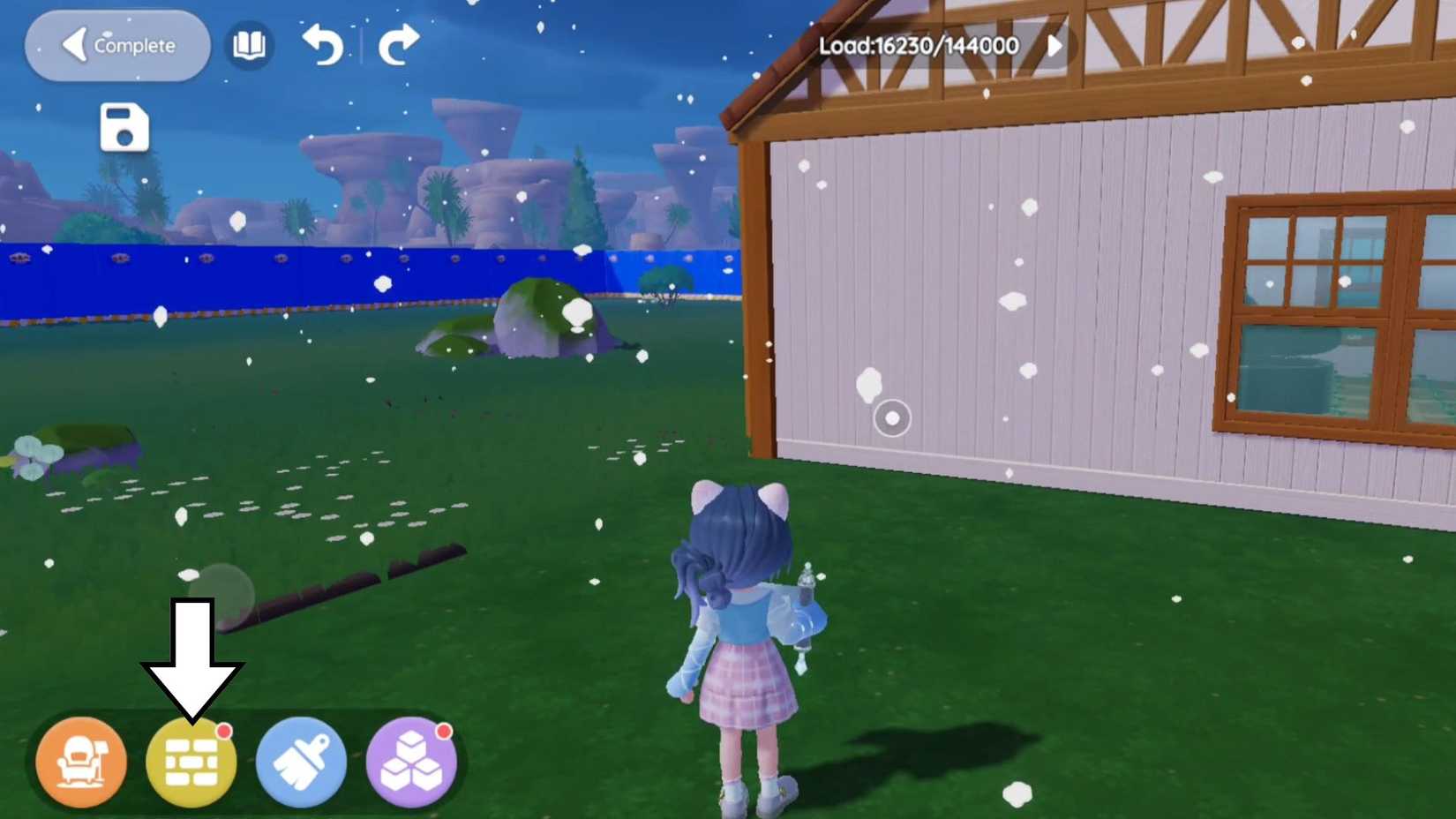 An arrow pointing towards the Building Materials tab inside Build Mode in Heartopia
