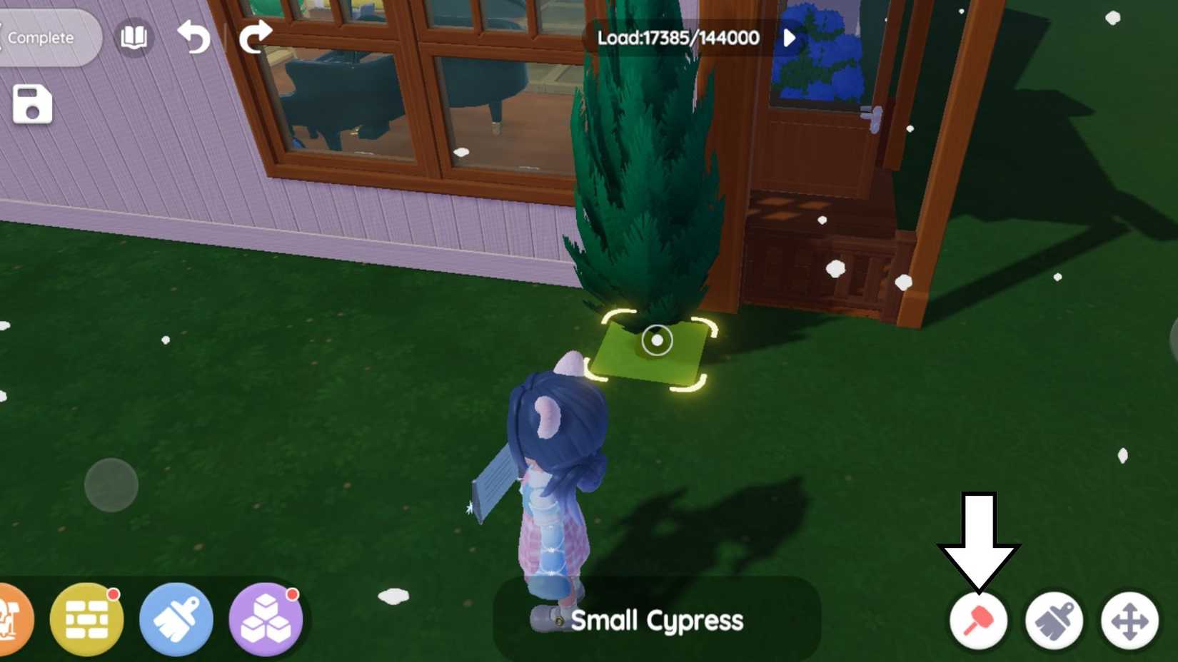 A Heartopia player in Build Mode with an arrow pointing towards the button used to remove basic plants