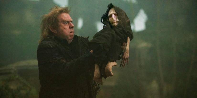 Wormtail holds up Voldemort's small body in Harry Potter and the Goblet of Fire