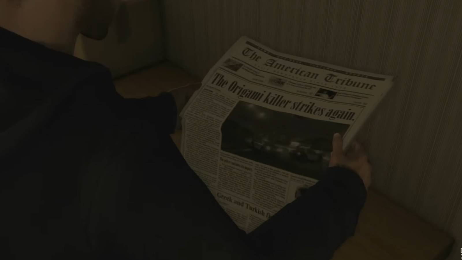 Reading a Newspaper of the Origami Killer in Heavy Rain