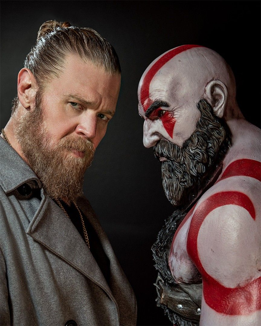 Kratos statue next to Ryan Hearst God of War Amazon TV series