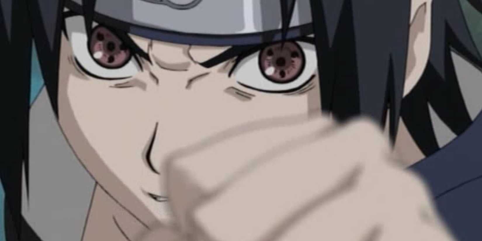 Sasuke raises a fist with his Sharingan activated.