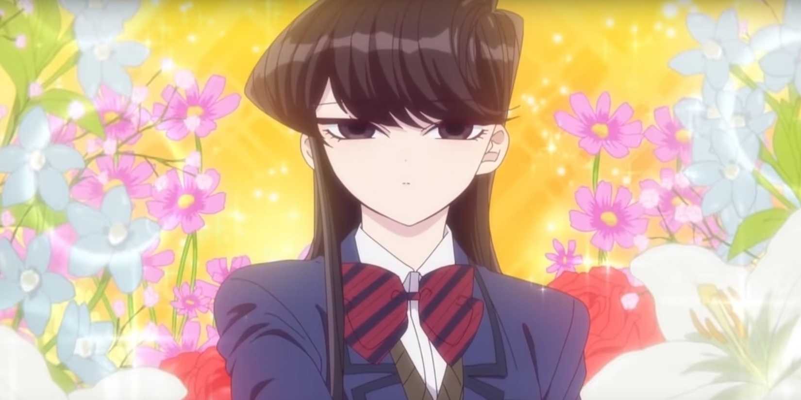 Shoko Komi with flowers in the background.