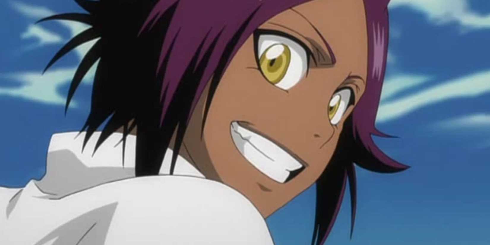 Yoruichi grinning widely against a blue sky.