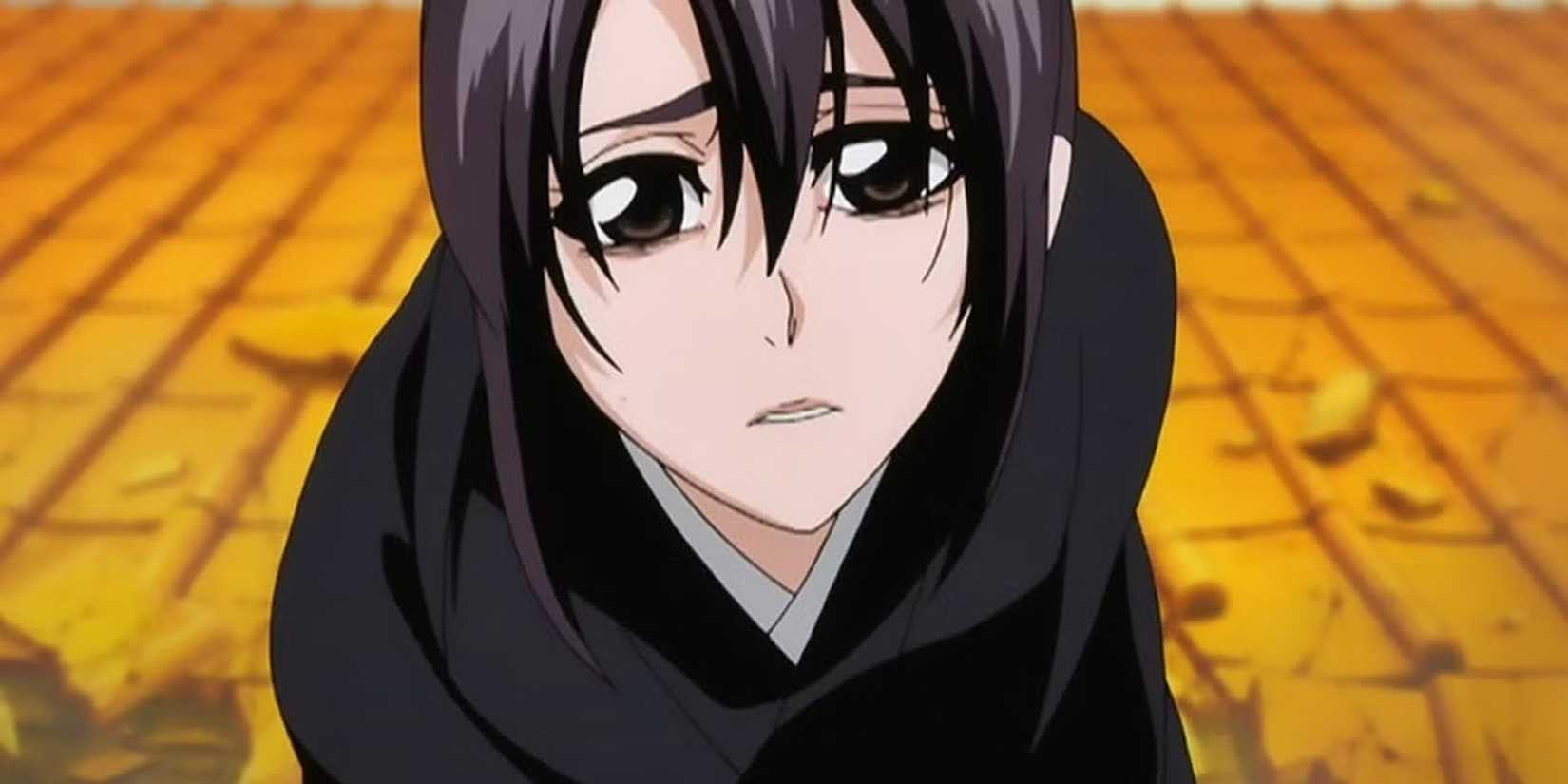 Momo Hinamori makes a sad face while standing on a rooftop.