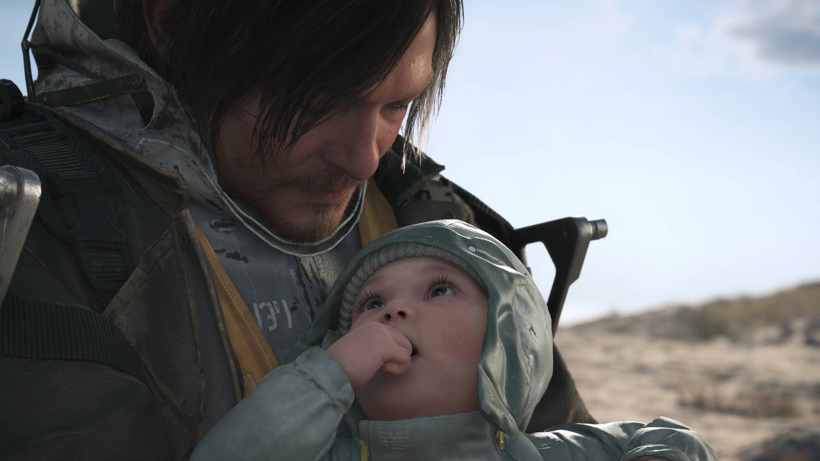 Sam holding Lou in Death Stranding 2 On the Beach (2025)