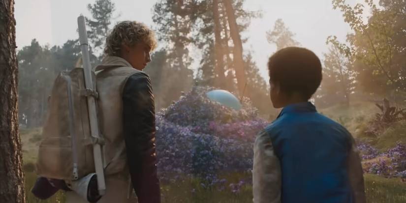 Haymitch and Ampert look at a hole in the arena in Sunrise on the Reaping