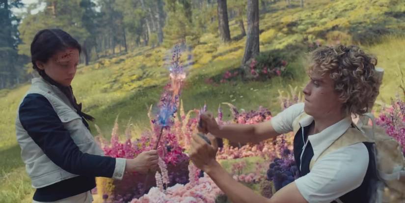 Haymitch and Lou Lou light flowers on fire in Sunrise on the Reaping