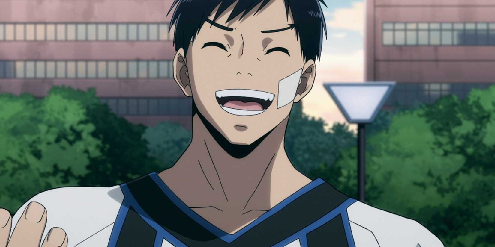 Tensei Iida smiles as he talks outside.