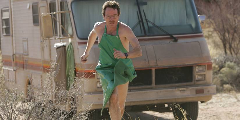 Walter White running in an apron in front of the meth lab RV in Breaking Bad Season 1 Episode 1.
