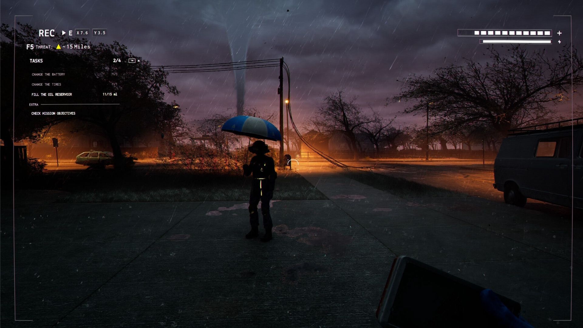 Storm chaser standing with umbrella