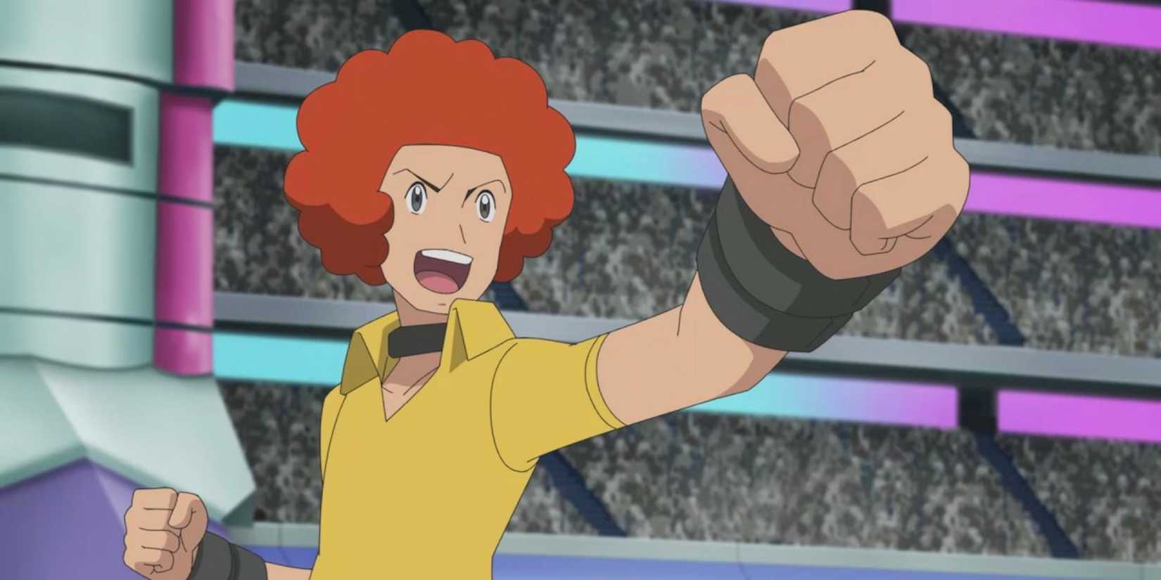 Flint of the Elite Four raises his fist on the battlefield with a wide smile.