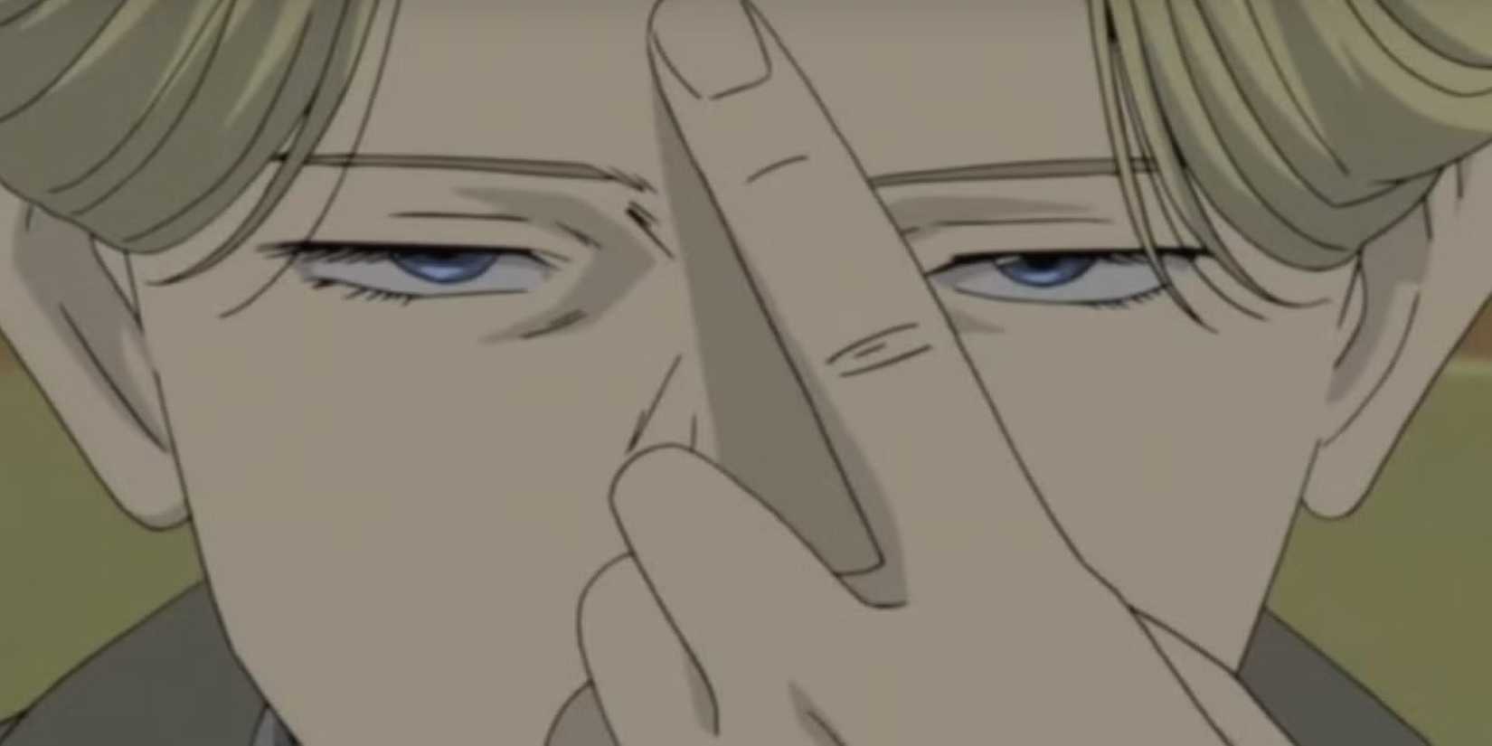Johan Liebert holds up his finger.