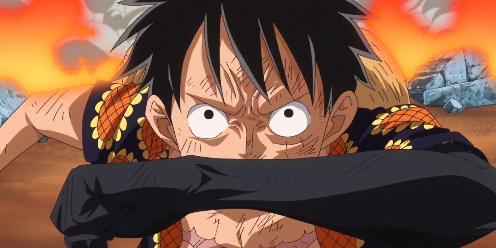 Luffy raises his arms and uses Haki.