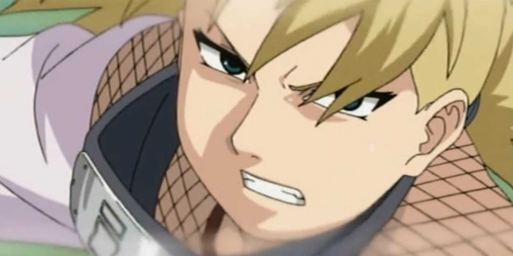 Temari bares her teeth as she rushes to the side.