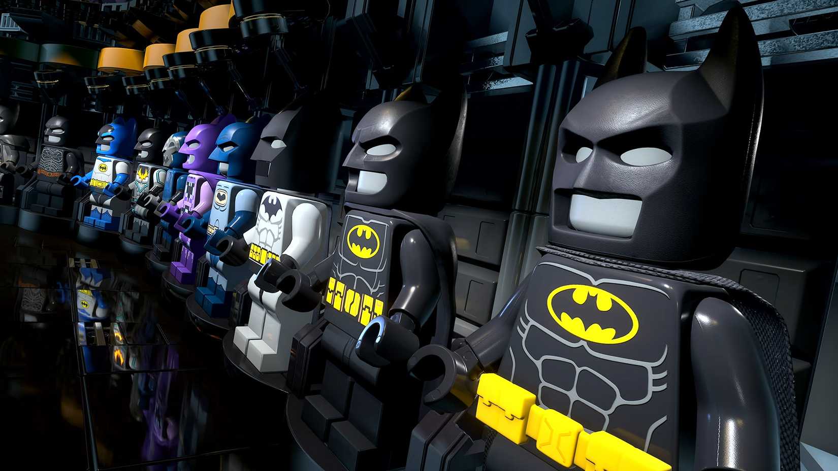 Batcave suit vault showing multiple unlockable costumes in LEGO Batman Legacy of the Dark Knight