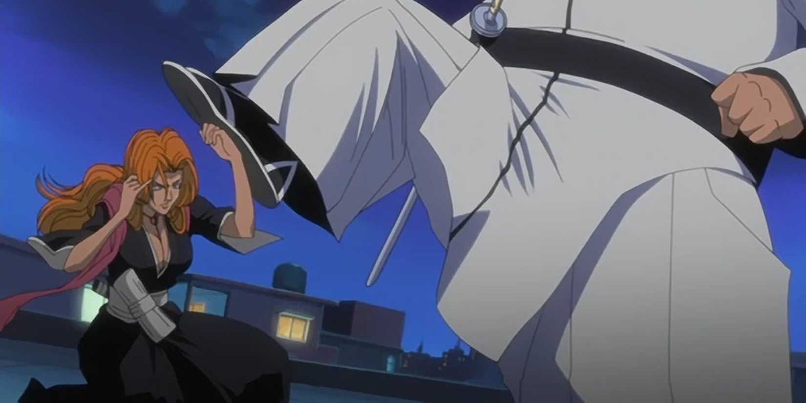 Rangiku blocks Nakeem's kick with her arm.