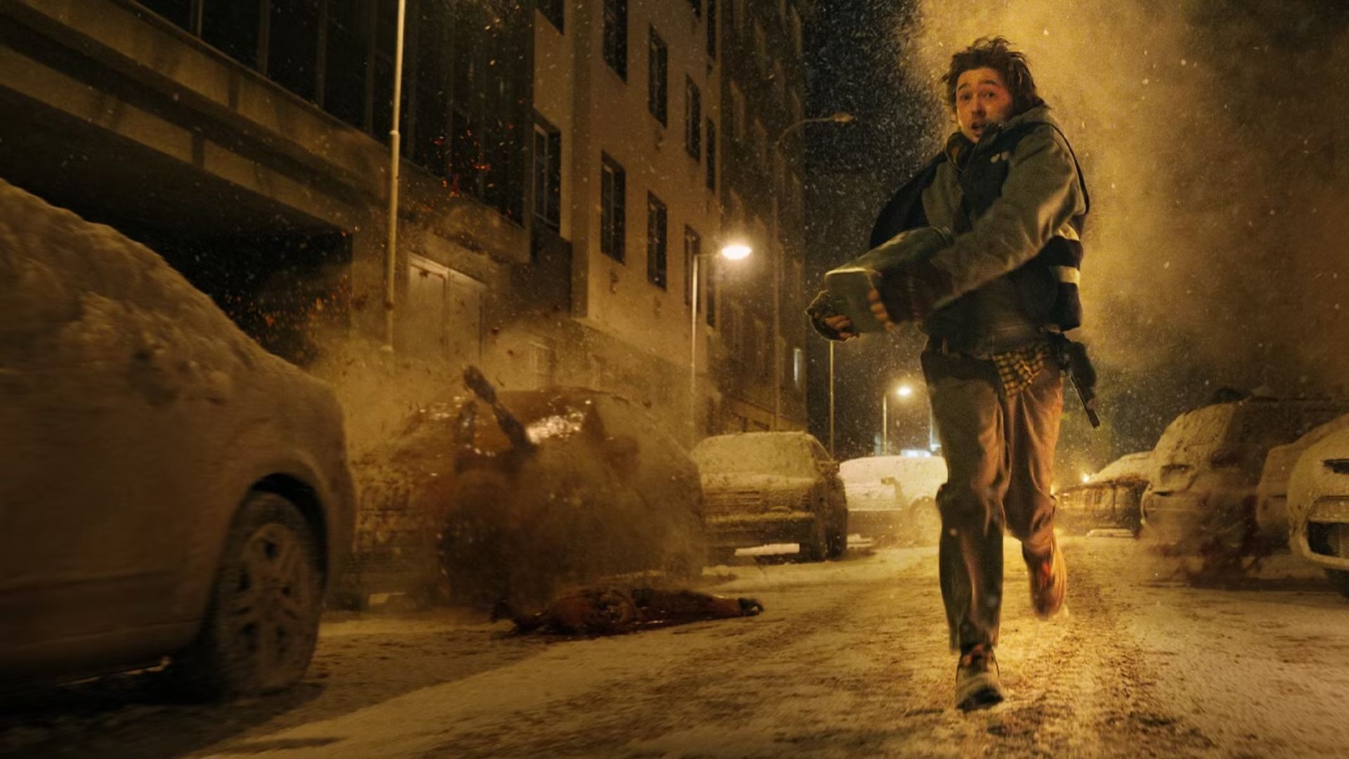 Resident Evil Movie Protagonist running in the street as zombies fall