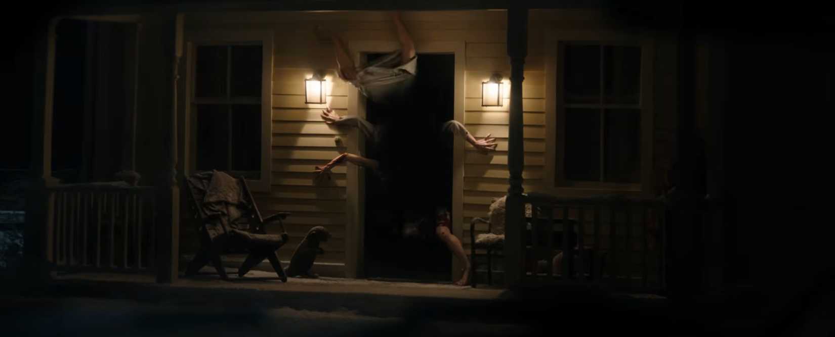 resident evil movie with zombies coming out of a doorway