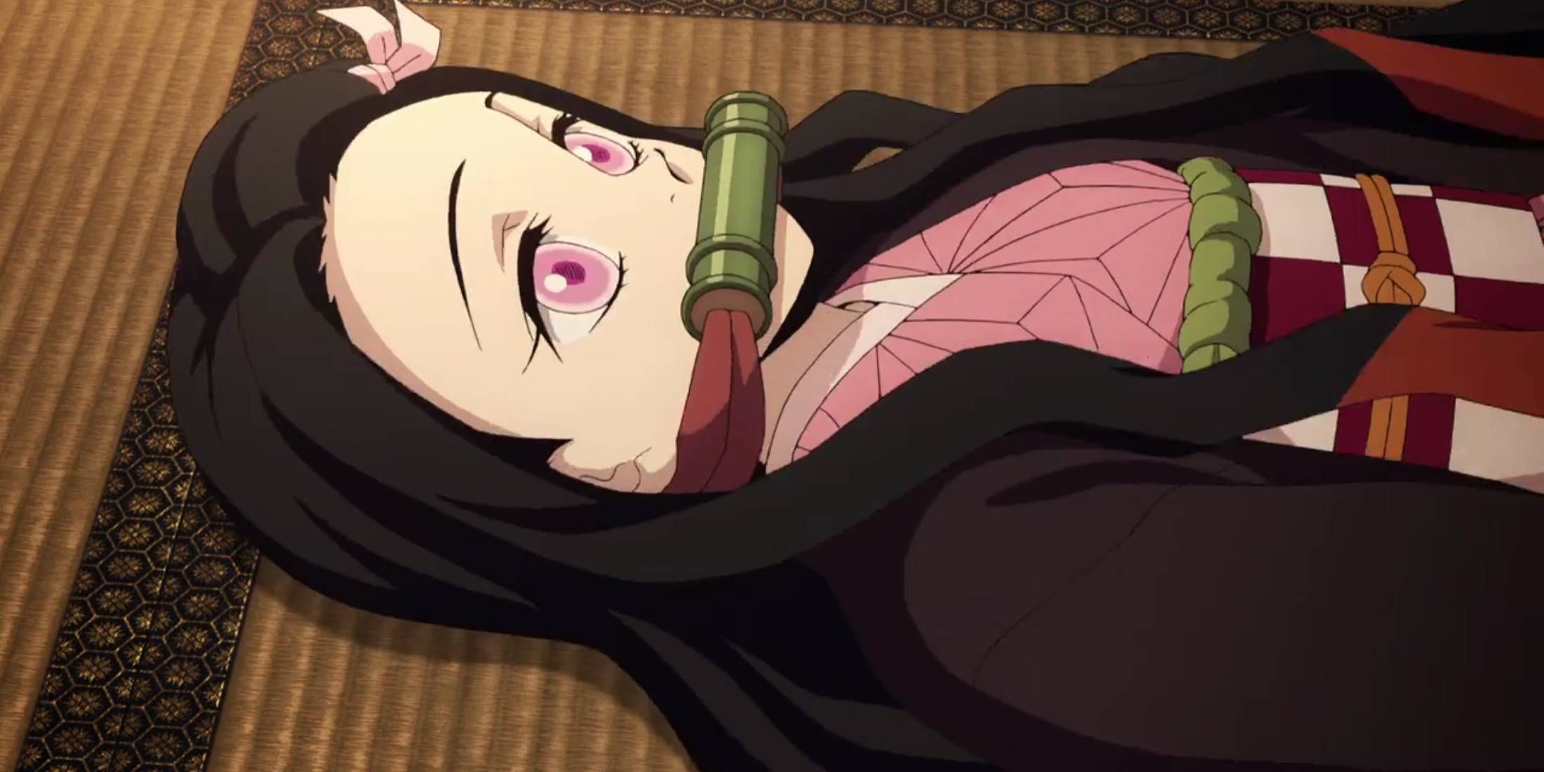 Demon Slayer Nezuko Kamado lays down on Tamayo's tatami mat in Season 1 Episode 8
