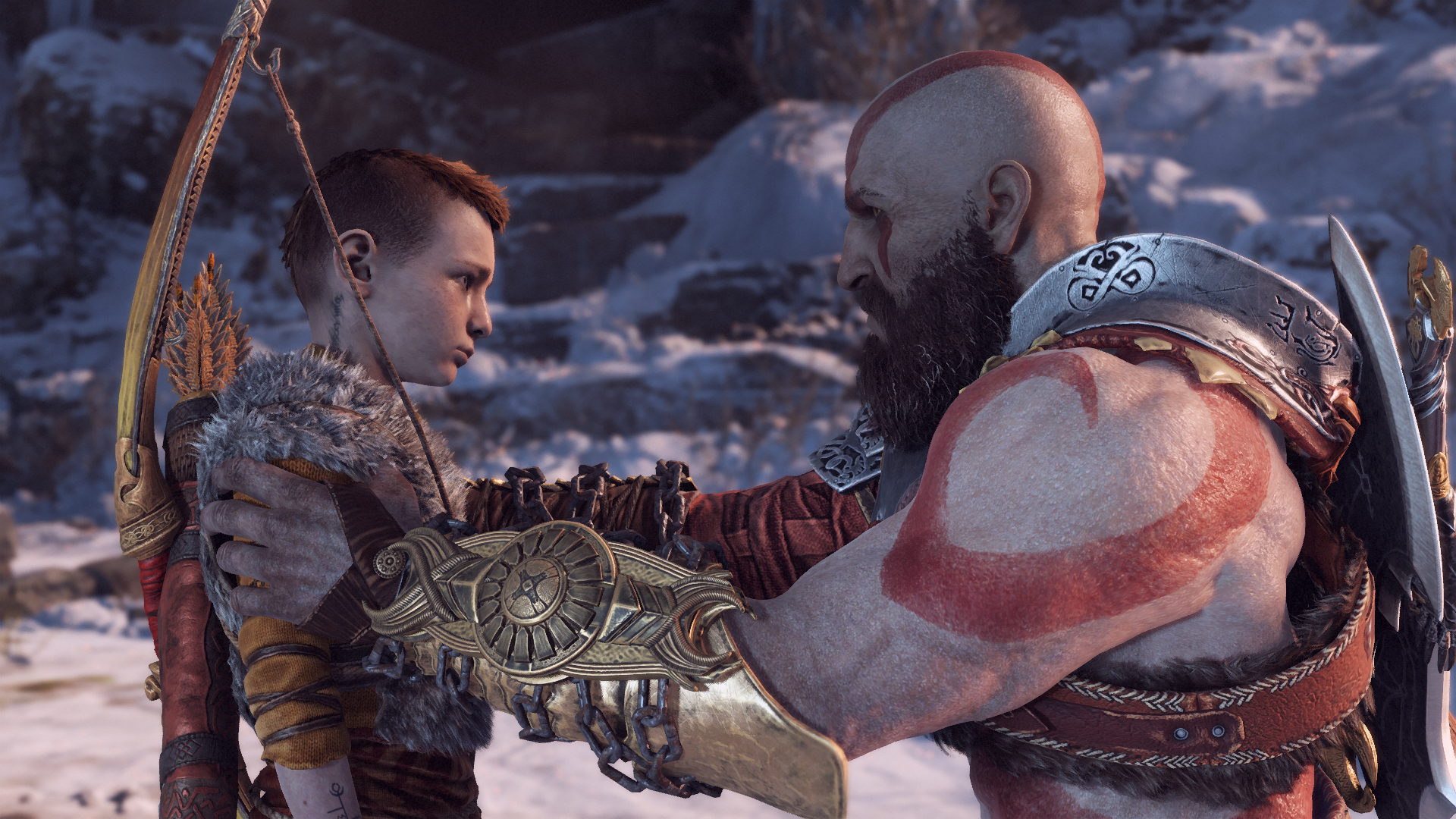 Kratos holds Atreus by the shoulders in God of War 2018