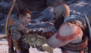 Kratos holding Atreus by the shoulders in God of War 2018