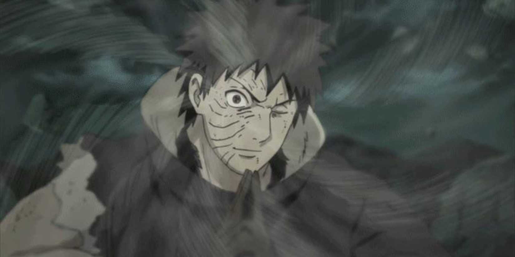 Obito smiles as he uses Kamui in Naruto