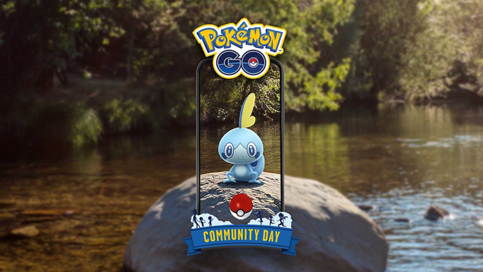 Pokemon GO Sobble seen from a phone screen sitting in a creek