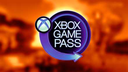 A purple Xbox Game Pass sign in front of a blurry orange landscape.
