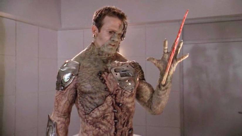 Adam projects a blooded spike from his wrist in Buffy the Vampire Slayer