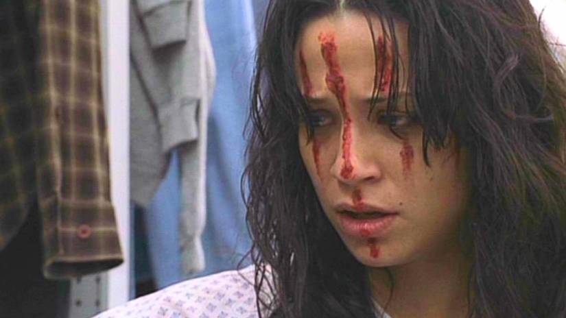 A bloody-faced Dana in a hospital gown in Angel