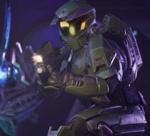Master Chief from Halo: Campaign Evolved with his rifle firing at an off-screen enemy.