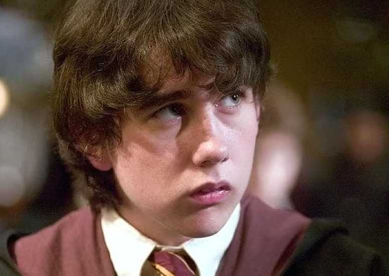 Neville in his Hogwarts uniform in Harry Potter