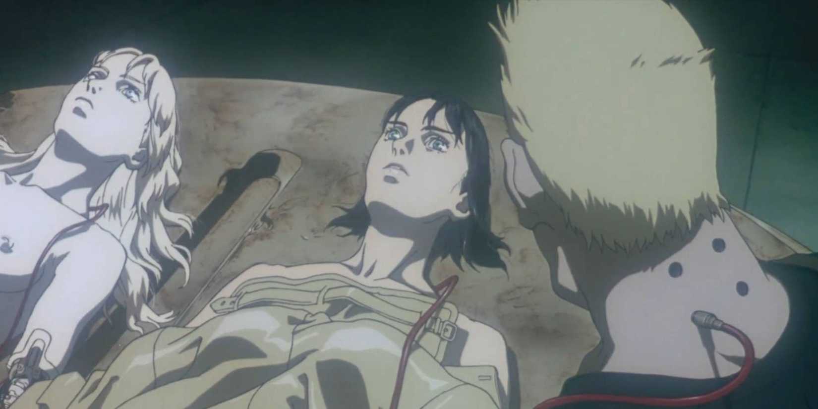 Project 2501 laying next to Major Motoko Kusanagi and Batou standing nearby are seen in the Ghost in the Shell 1995 movie