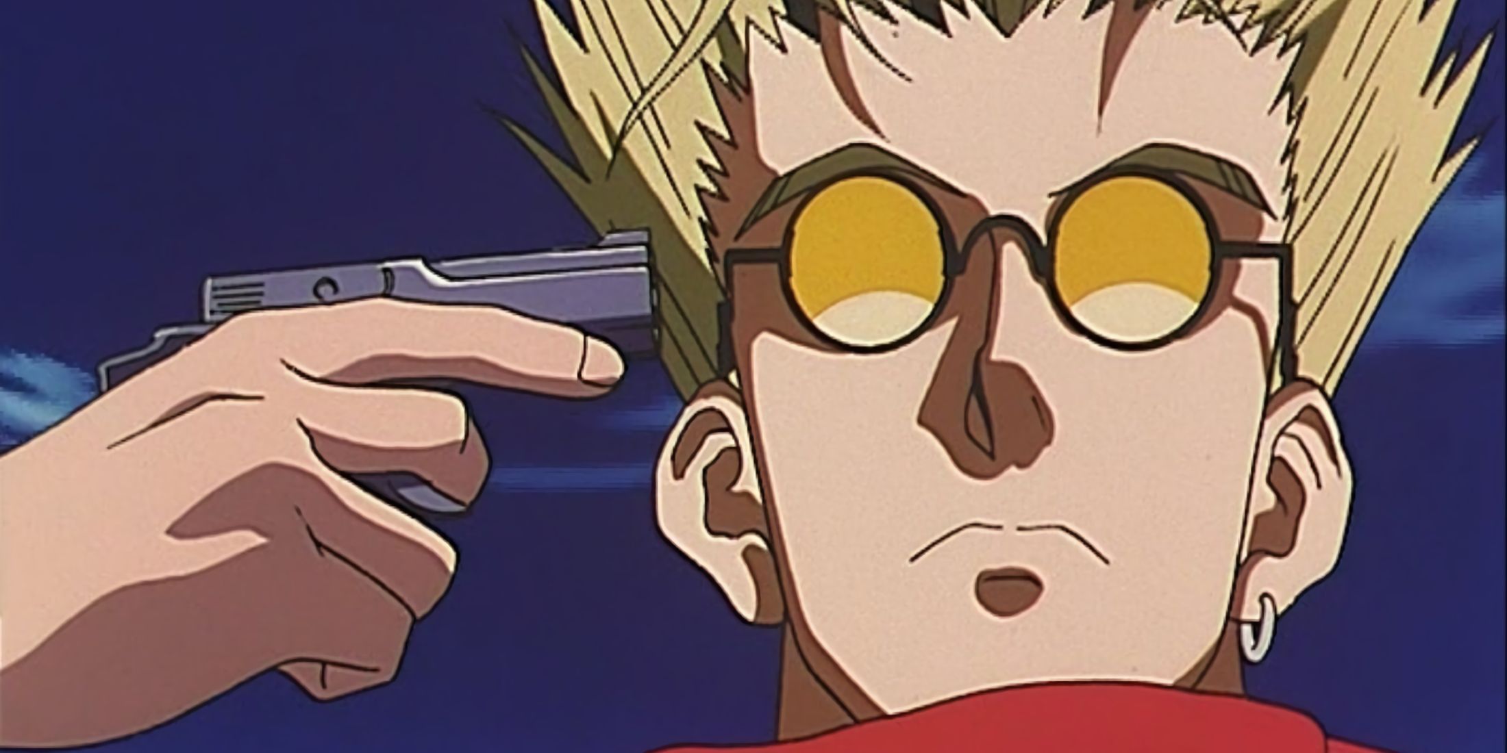 Vash pointing a gun at himself as he stares down at the human traffickers. 