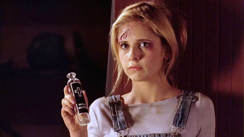 A bloodied Buffy holds up a bottle of holy water in Buffy the Vampire Slayer Season 3