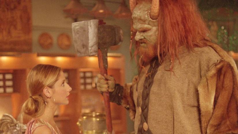 Olaf the Troll God looms over Buffy in The Magic Shop in Buffy the Vampire Slayer Season 5 