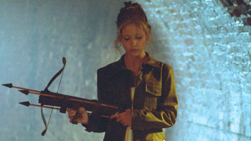 Buffy walks through the sewer tunnels armed with her crossbow in Buffy the Vampire Slayer Season 1
