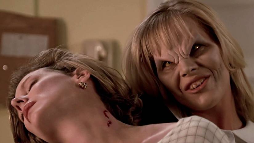 Darla, with vamp-face, drinks a woman's blood in Buffy the Vampire Slayer
