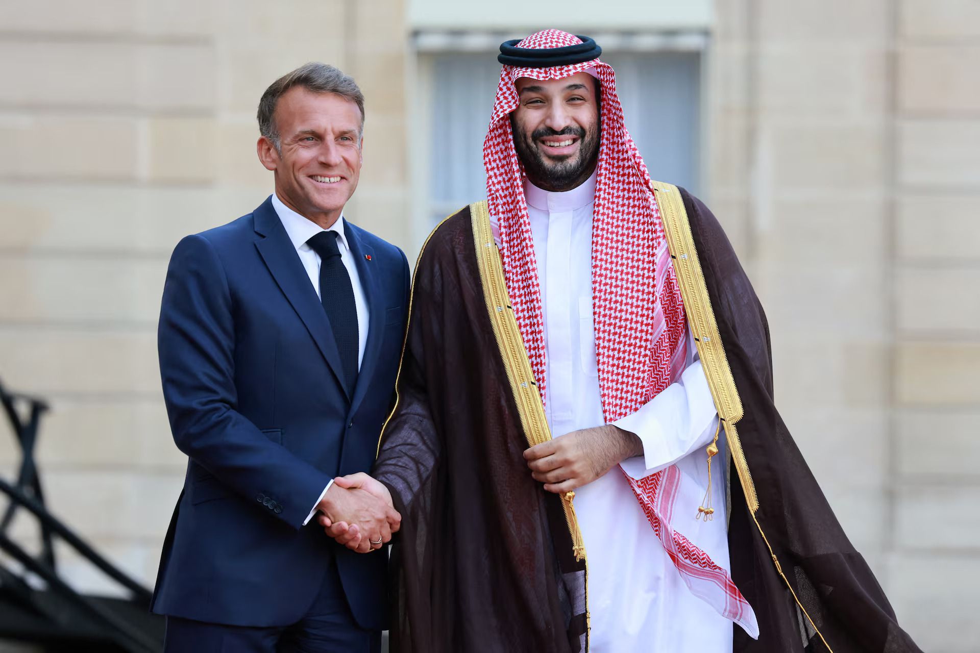 French President Emmanuel Macron shakes hands with Saudi Crown Prince Mohammed bin Salman as he arrives for a meeting at the Elysee Palace in Paris, France, August 24, 2026.