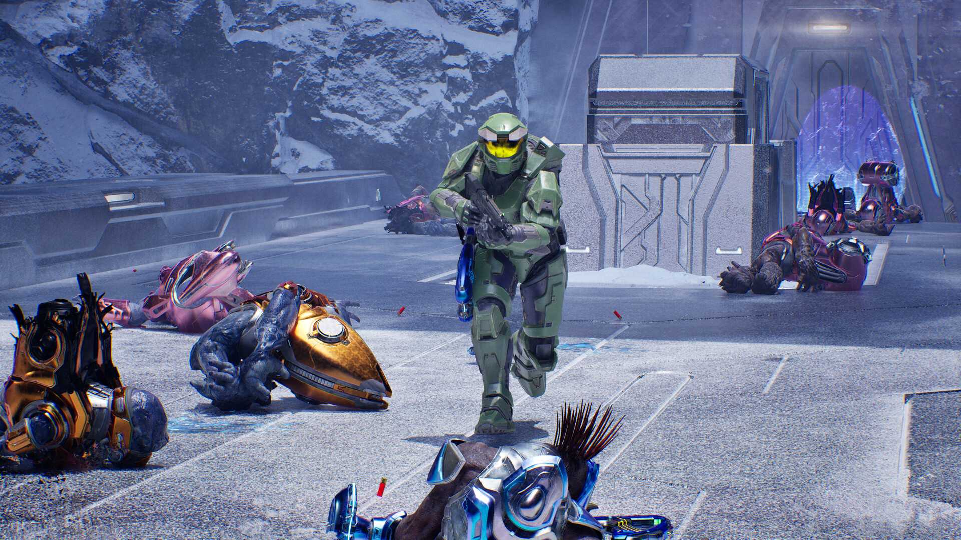 Master Chief amongst Covenant corpses in Halo: Campaign Evolved.