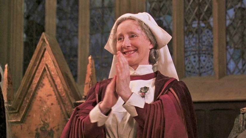 Madam Pomfrey claps in the Hogwarts Great Hall in Harry Potter and the Chamber of Secrets