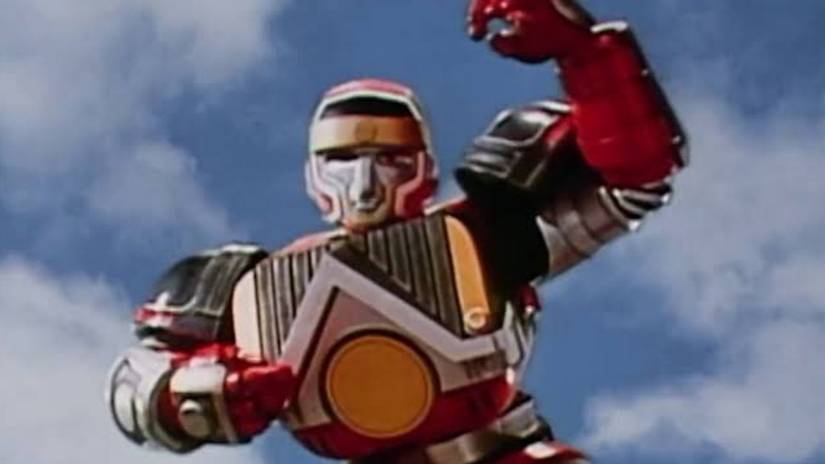 Red Shogunzord posed with one arm up and one arm in front of chest in Mighty Morphin Power Rangers