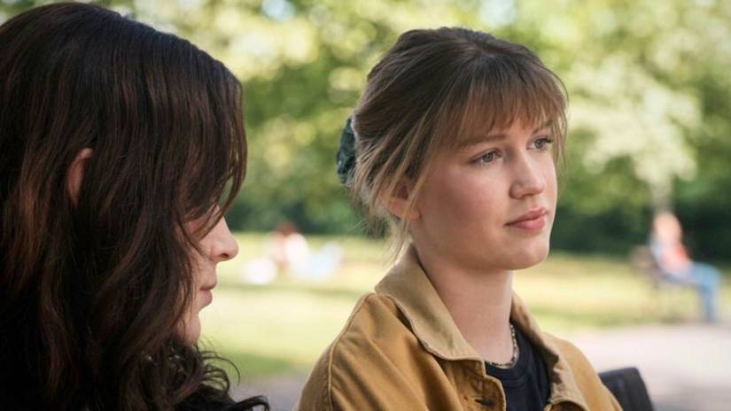 Jean Grey looks at her sister Sara Grey as they sit on a park bench in Spider-Man: Brand New Day 
