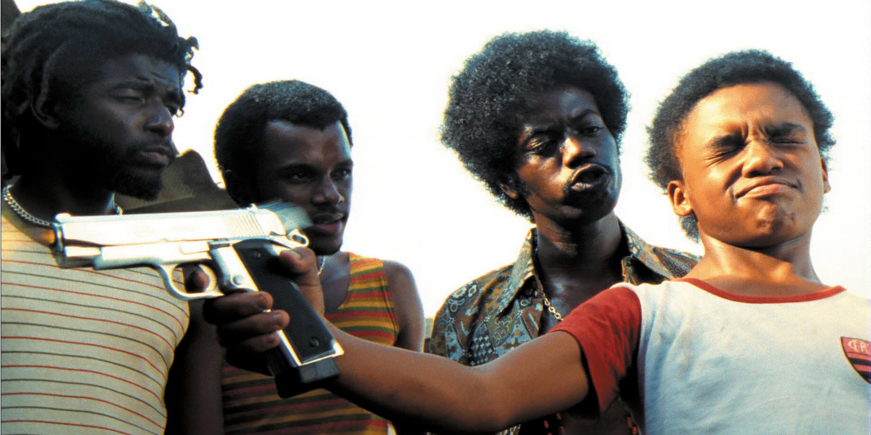 The characters in City of God with one boy holding a gun